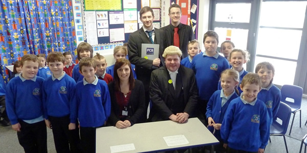 David Adams and Oliver Nicholas of PCB Solicitors (back row) along with Stacey Murray Danny Smith and pupils from Mount Pleasant Primary School