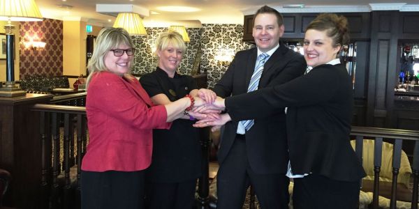 Staff from The Buckatree Hall Hotel and Telford College of Arts and Technology celebrate new partnership