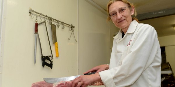 Kay Badley cuts meat