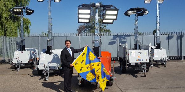 Chris Morris flying the Shropshire flag with the companies lighting towers en route to Australia