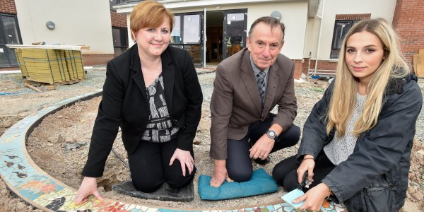 Debbie Price, Councillor Kevin Pardy with Natalie Izquierdo from Designs in Mind who is one of the team who has been installing the mosaic