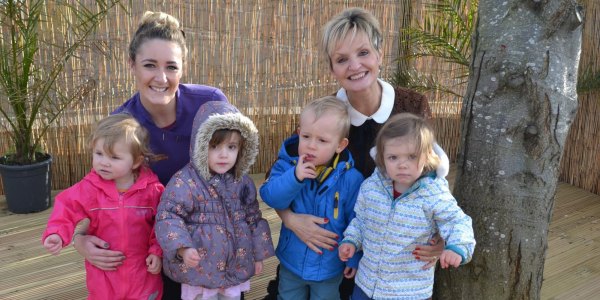 Staff members, Charlotte Lewis (Senior Practitioner) and Jane Smalley (Principal and Managing Director) pictured with Florence, Olivia, Oscar and Beatrice