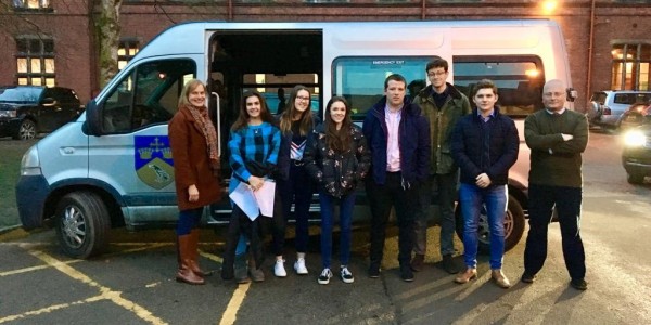 Maths teacher Kate Curzon and Col Martin Clewlow with students leaving Ellesmere College for Manchester.
