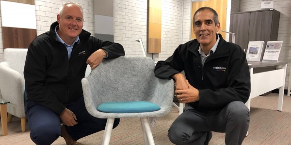 Chrisbeon's Craig and Richard Hughes with a chair made of recycled bottles.