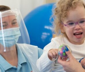 One of the first children back at The Movement Centre, Amelie, with Sarah Bew, Clinical Specialist Physiotherapist.
