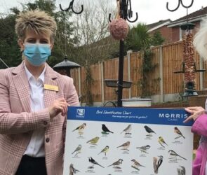 Radbrook Nursing Home General Manager, Jo Bennett and resident Sybil Williams with the bird feeders and identification boards donated by CJ Wildlife