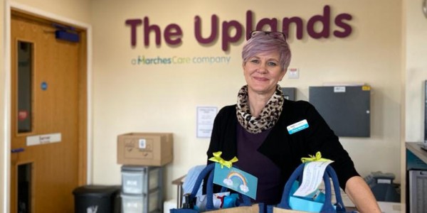 Fee Glover at The Uplands receiving their self-care hampers