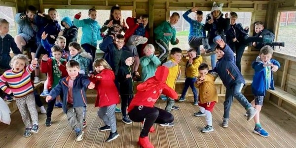 Children having fun at a previous Crossbar Ninja Warrior-themed holiday club