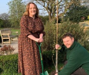 Morris Care CEO Lucy Holl planting a tree for the Platinum Jubilee with gardener James Glennon at Isle Court Nursing Home in Shrewsbury