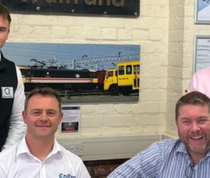 Group of four men from EnPro rail services stood with members of Q Financial Services