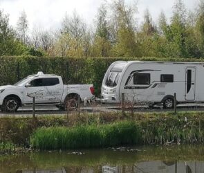 A large car towing a caravan