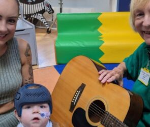 Axel and mum Rhiannon with volunteer Judith