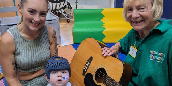 Axel and mum Rhiannon with volunteer Judith