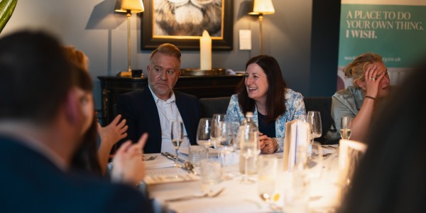 People chatting at a table in a restaurant