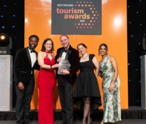 Clare Wells, Sid and Beth Heath from Shropshire Festivals collecting their gold award