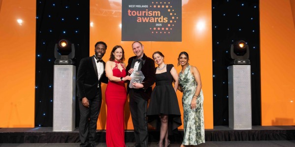 Clare Wells, Sid and Beth Heath from Shropshire Festivals collecting their gold award